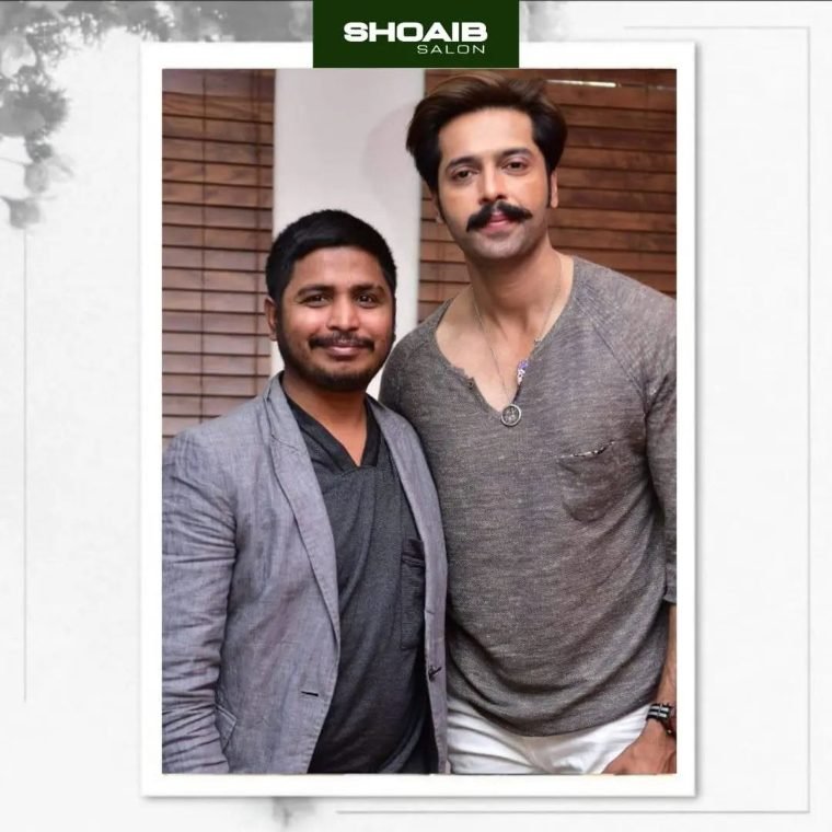 Shoaib Bashir with a client at the salon